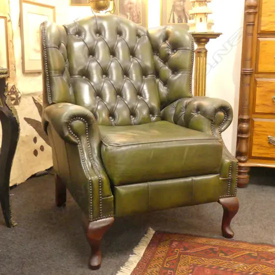 GREEN LEATHER BUTTONED BACK WING BACK ARM CHAIR