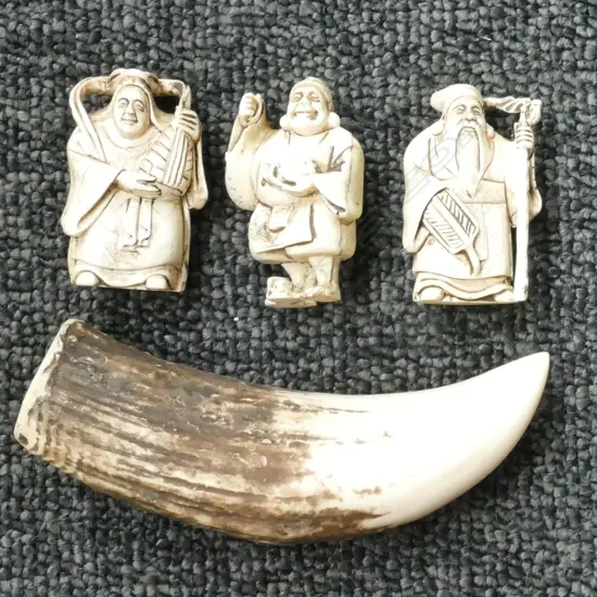 THREE REPLICA RESIN NETSUKES AND FAUX TOOTH