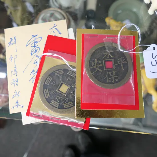 TWO CHINESE LG COINS WITH CARDS