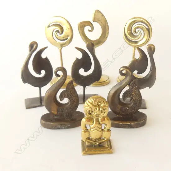 NINE BRASS TIKI & KORO ON STANDS, TALLEST: 120MM