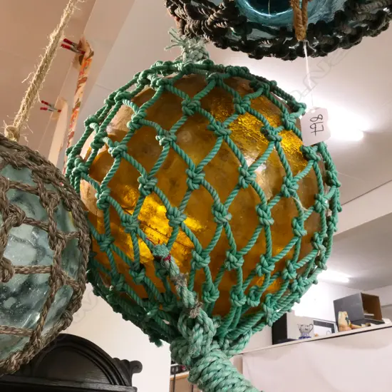 OLD LARGE GLASS FISHING FLOAT WITH NETTING...