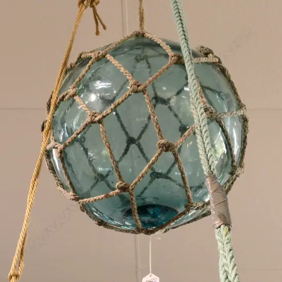 OLD GLASS FISHING FLOAT WITH NETTING...