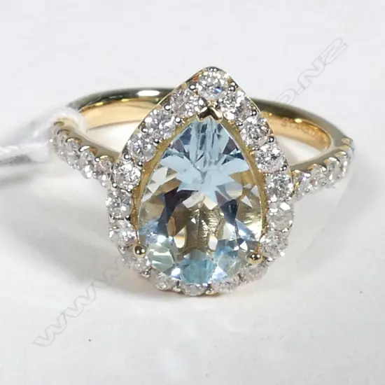 14ct Yellow Gold Aquamarine and Diamond ring featuring centre
