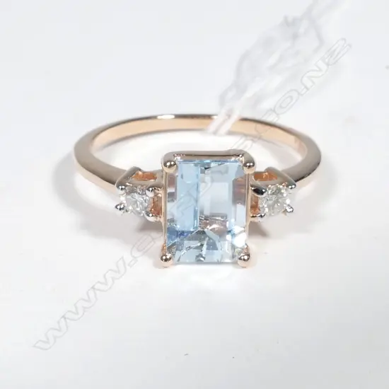 14ct Rose Gold Aquamarine and Diamond ring featuring centre