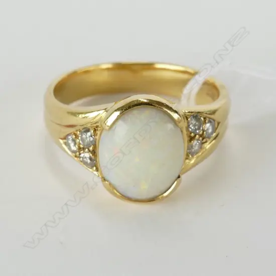 18CT GOLD OPAL AND DIAMOND RING VAL.$2500.00