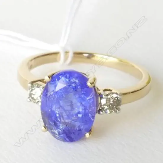 14ct Yellow Gold Tanzanite and Diamond ring featuring centre