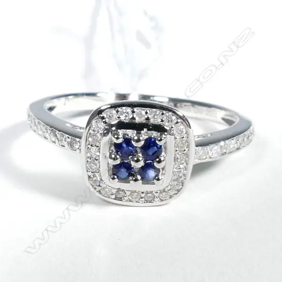 10ct White Gold Sapphire and Diamond halo ring featuring centre