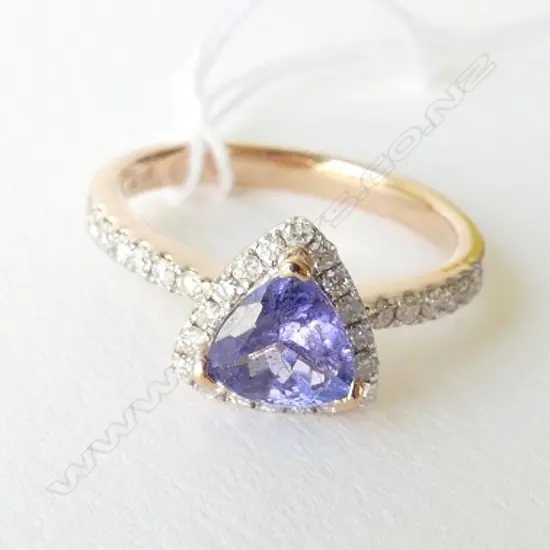14ct Rose Gold Tanzanite and Diamond ring featuring centre