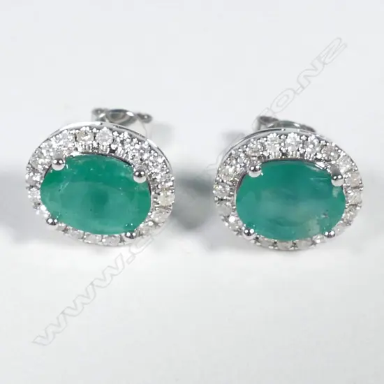 14ct White Gold Emerald and Diamond stud earrings featuring