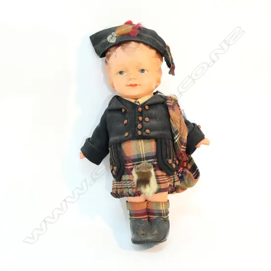 A CELLULOID DOLL IN SCOTTISH COSTUME H 290 MM A/F