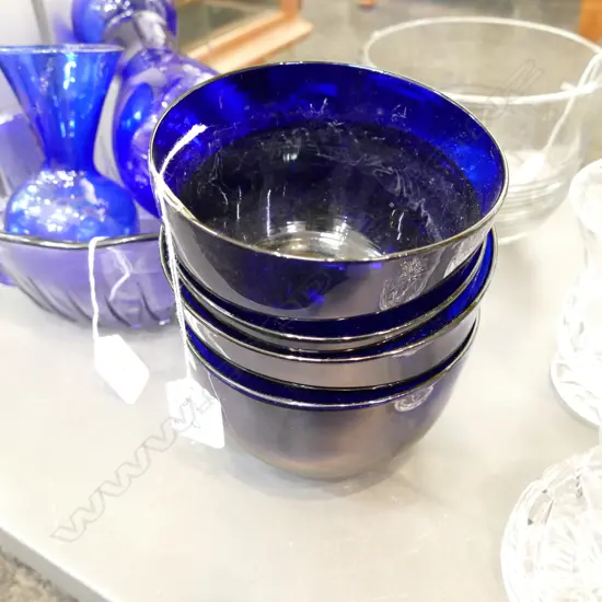 FOUR BRISTOL BLUE ANTIQUE GLASS WASHERS