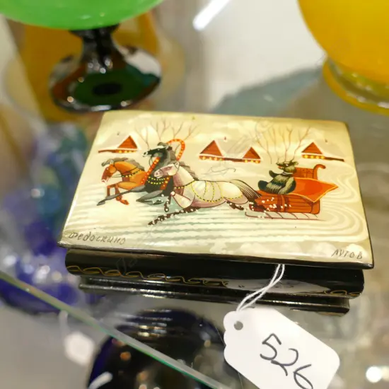 OBLONG RUSSIAN HAND PAINTED LACQUER PAPIER MACHE BOX DECORATED WITH A BEAR RIDING A TROIKA. W.90mm