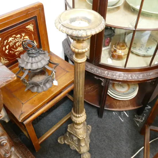 A GILDED METAL CANDLE STAND H 1000 MM