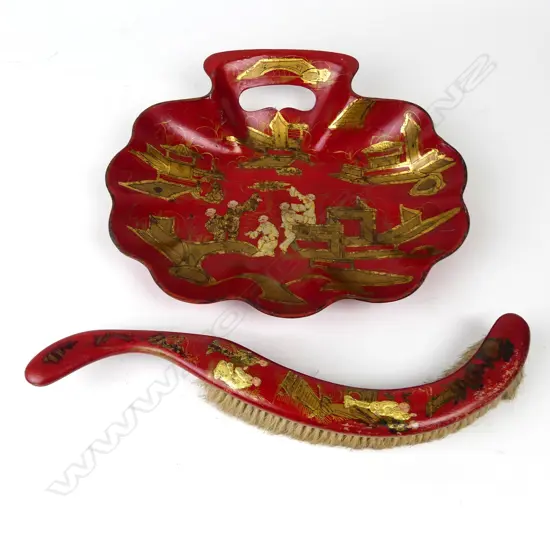 A vintage chinoiserie red lacquer crumb tray and brush