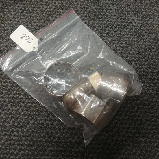 4 S/S NAPKIN RINGS + 1 IVORY 