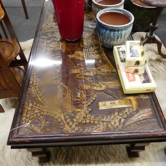 CARVED ORIENTAL LOW TABLE W GLASS TOP