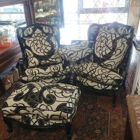 PAIR OF EBONISED FRENCH STYLE ARMCHAIRS + OTTOMAN