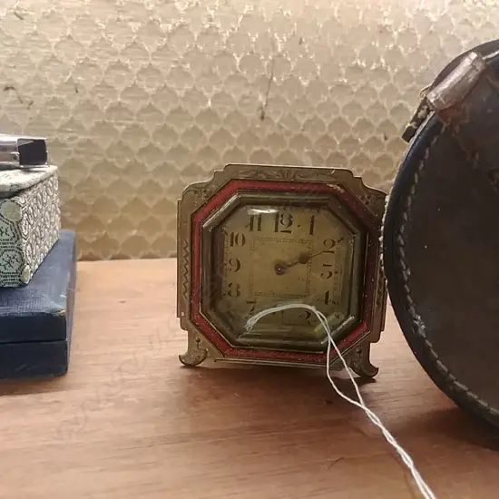 BRASS AND ENAMEL TRAVELLING CLOCK