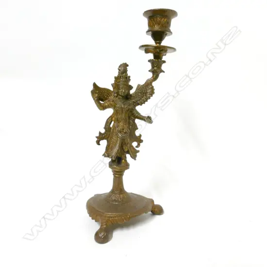 An Indian gilt metal candlestick