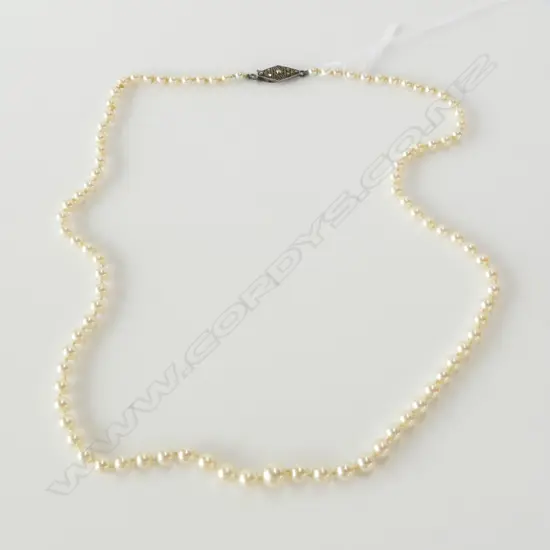 GRADUATED STRAND OF MIKIMOTO PEARLS