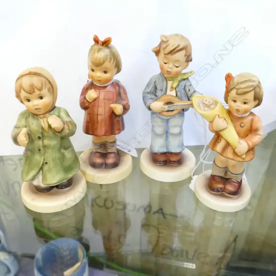 4 BOXED HUMMEL FIGURINES