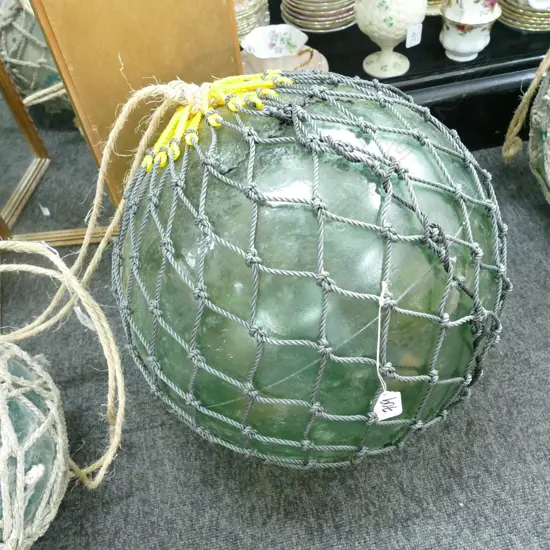 LARGE GLASS FISHING FLOAT WITH NETTING...