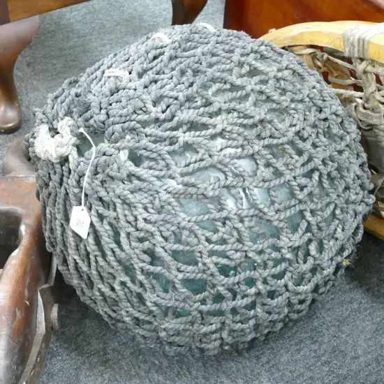 OLD LARGE GLASS FISHING FLOAT WITH NETTING...