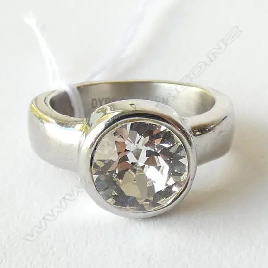 A DYRBERG KERN STEEL RING SET WITH A LARGE SWAROVSKI CRYSTAL