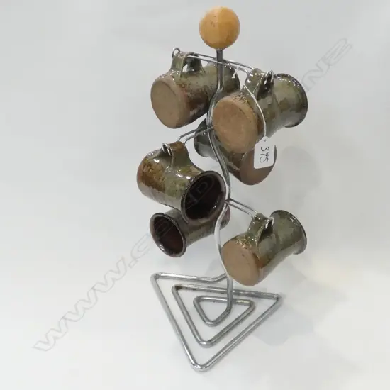 6 PC ANDREW VAN DER PUTTEN COFFEE MUG AND STAND