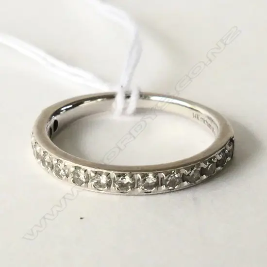 14CT WHITE GOLD AND DIAMOND BAND TDW 0.34CT.