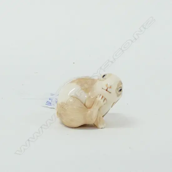 JAPANESE CARVED IVORY HARE SIGNED SCRATCHING POSE
