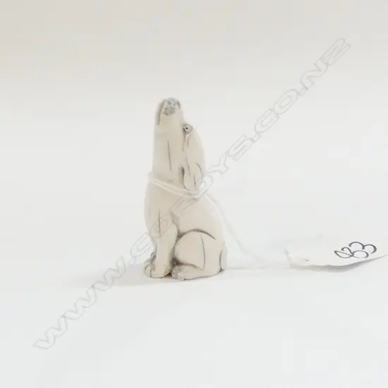 JAPANESE CARVED IVORY HOWLING DOG NETSUKE