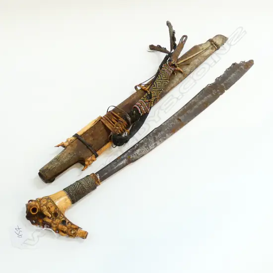 Old Dayak mandau short sword from Borneo. carved bone handle