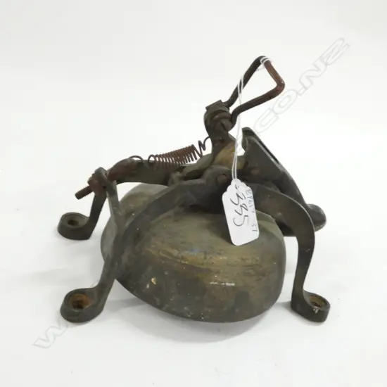 A WALL MOUNTED BRASS BELL