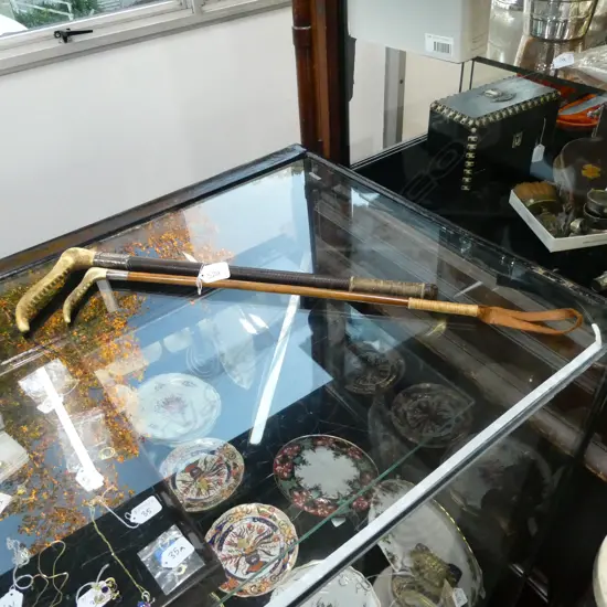 2 RIDING CROPS, ONE w SILVER COLLAR