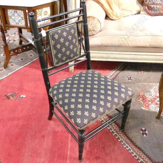 EBONISED SPINDLE BACK SIDE CHAIR UPHOLSTERED IN FLEUR-DE-LYS FABRIC