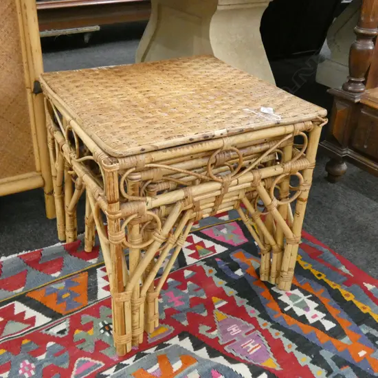 NEST OF THREE CANE TABLES