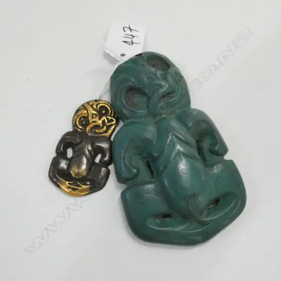 2 TIKI PENDANTS, ONE GREEN PAINTED STONE & ONE BRONZE