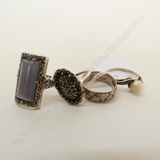 FOUR SILVER RINGS