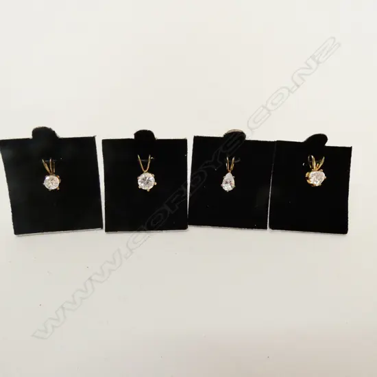 FOUR FAUX DIAMOND PENDANTS