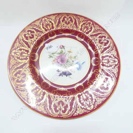 A Royal Worcester circular rack plate