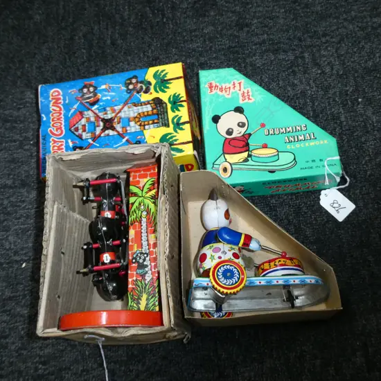 2 WIND UP TOYS; DRUMMING PANDA & MERRY GOROUND
