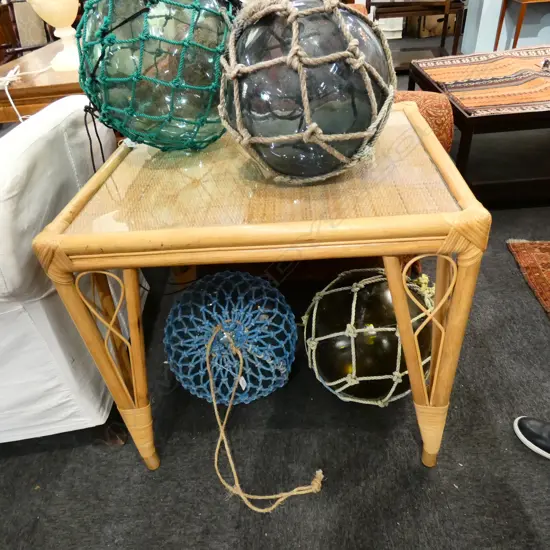 GLASS TOPPED CANE TABLE H. 740MM L. 760MM