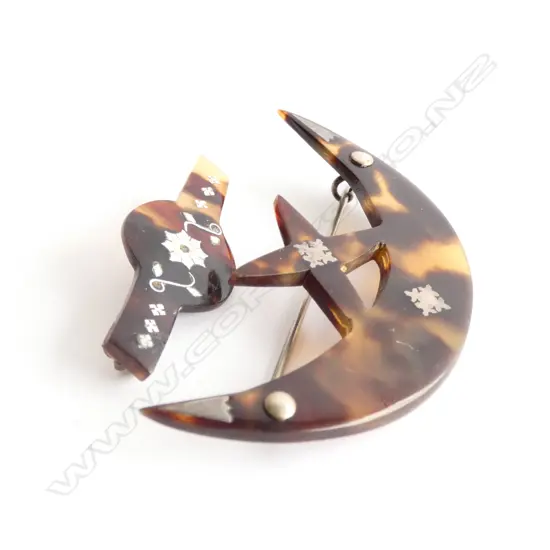 TWO PACIFIC TORTOISE SHELL AND SILVER BROOCHES