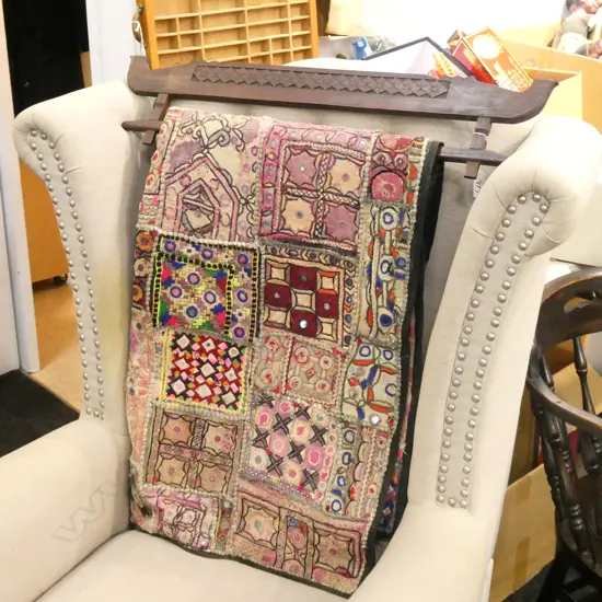 INDIAN WALLHANGING ON WOODEN RAIL