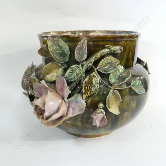 A VICT MAJOLICA JARDINIERE WITH FLORAL RELIEF DECORATION H 220 MM WITH FAULTSN