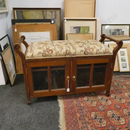 UPHOLSTERED PIANO STOOL WITH GLAZED CABINET BASE W. 920MM