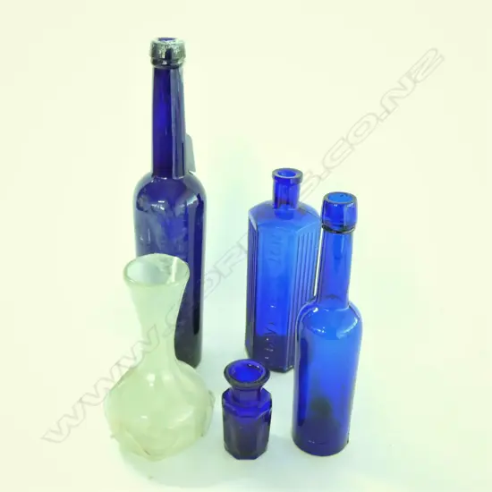 FOUR COBALT BLUE GLASS BOTTLES & 19TH CENTURY VASE W TRAILINGS....