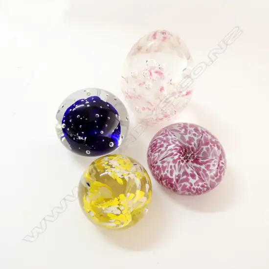 FOUR GLASS PAPERWEIGHTS