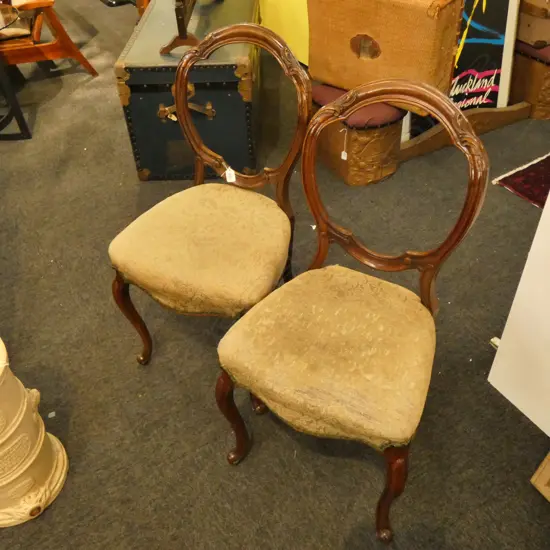 A PAIR OF VICT WALNUT BALLOON BACK CHAIRS